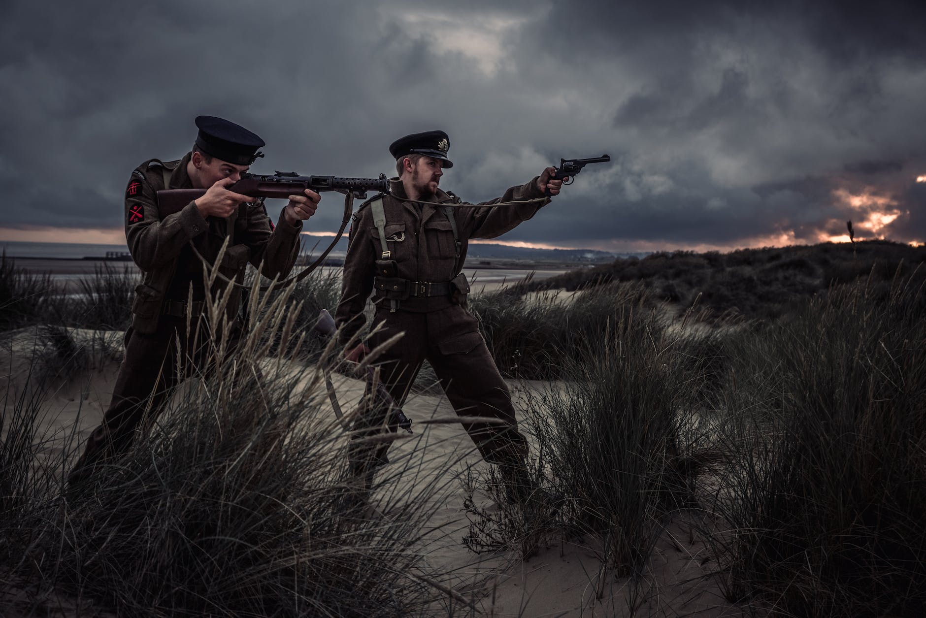 two man holding rifle and pistol illustration